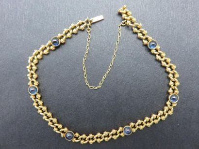 Bracelet or jaune 750 millièmes serti clos...