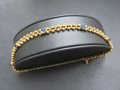 Bracelet or jaune 750 millièmes serti clos...