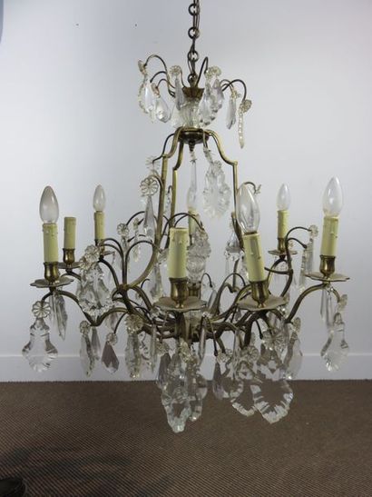 Lustre en bronze à neuf bras arqués de lumière,...