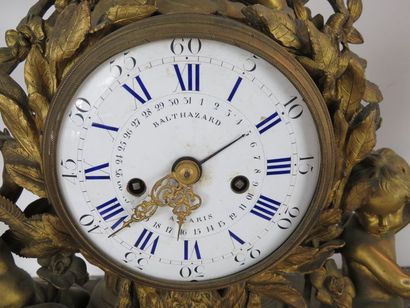 Importante pendule et paire de candélabres....