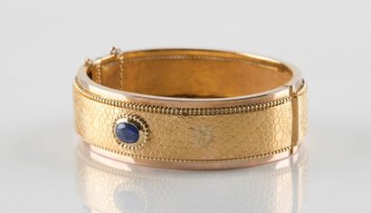 Bracelet jonc ouvrant, aux motifs d'écailles...