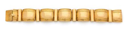 Bracelet 

en or 18K (750) articulé de maillons...