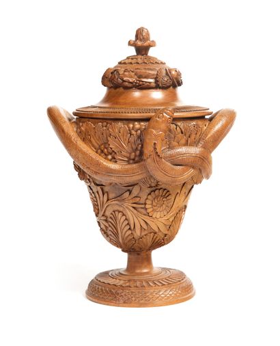Covered urn

in limewood decorated with a...