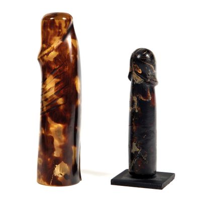 Two carved penises

in tortoise shell, one...