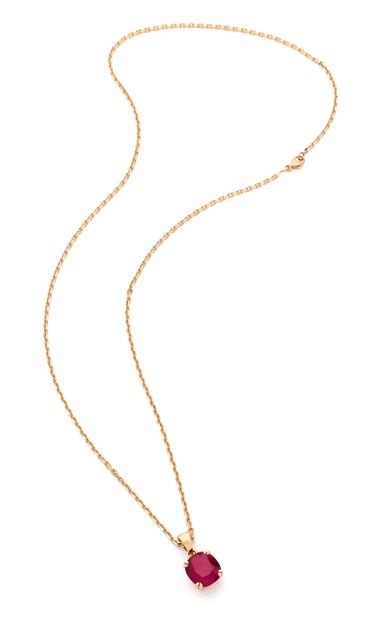 Pendentif 

en or 18K (750) orné d'un rubis...