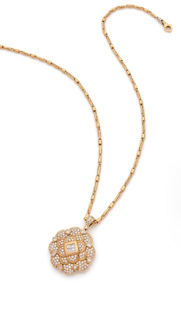 Pendentif 

en or 18K (750) dessinant une...