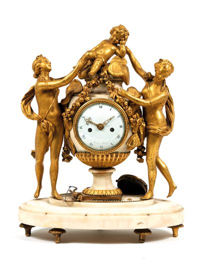 Clock
in white marble and gilt bronze representing...