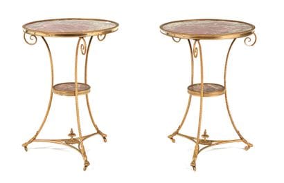 Pair of pedestal tables
in chased and gilded...