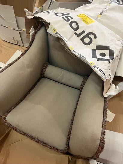 Living room with a sofa and a pair of armchairs...