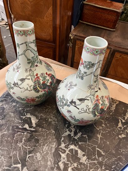 Pair of porcelain vases with polychrome decoration...
