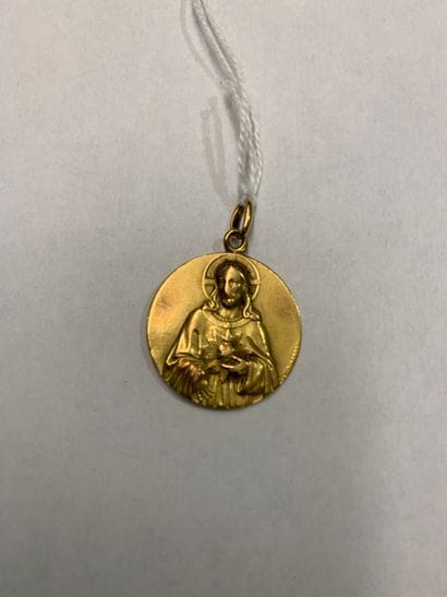 Medal in yellow gold for Christ with a burning...