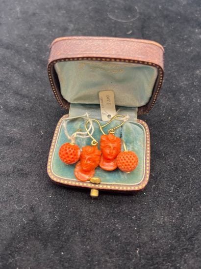 Case containing two pairs of coral earrings...