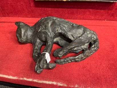 20th century school 
Reclining cat
Brown...