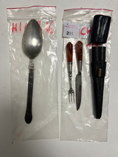 Set including a travel spoon with silver...
