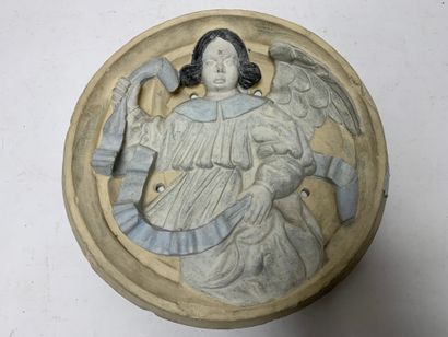 Carved stone medallion featuring an angel
Early...