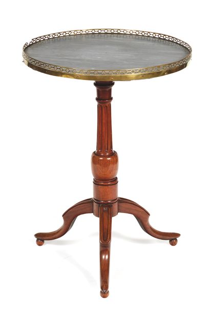 Moulded mahogany pedestal table on a baluster...
