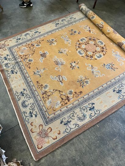 Chinese carpet with yellow background and...