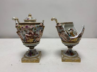 Pair of small covered vases on pedestal decorated...