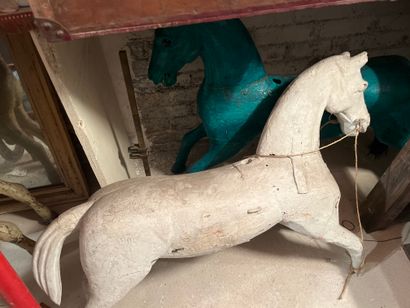 Three merry-go-round horses in lacquered...