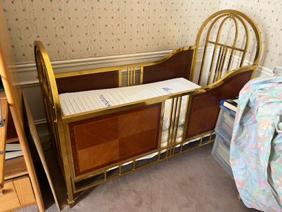 Gilded brass and inlaid wood panel crib 
Circa...