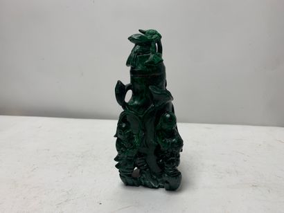 A small covered malachite vase
Damage and...