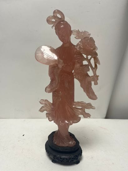A rose quartz statuette of a woman, plinth...