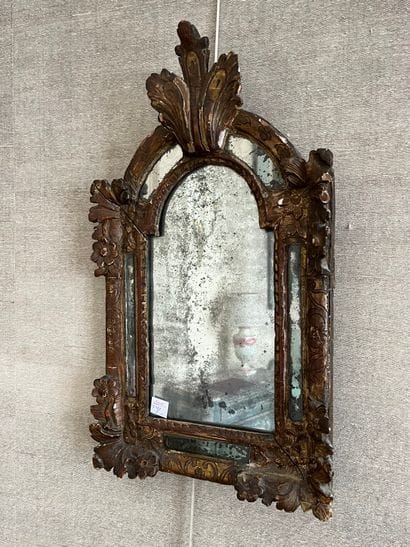 Gilded wood mirror molded with flowers and...