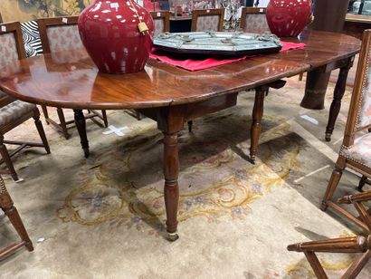 Solid mahogany two-leaf dining table on double...