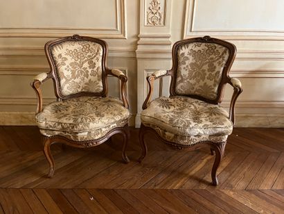 Pair of armchairs in molded and carved natural...
