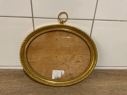 Oval gilt bronze frame, chased with pearl...