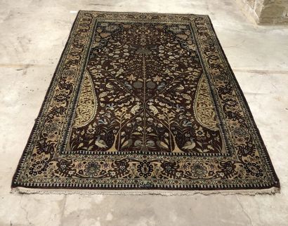Wool and silk carpet decorated with animals...