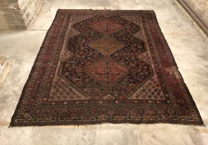 Wool carpet with central decoration of three...