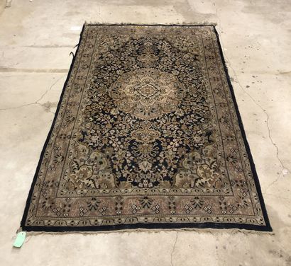 Wool carpet decorated with a central medallion...