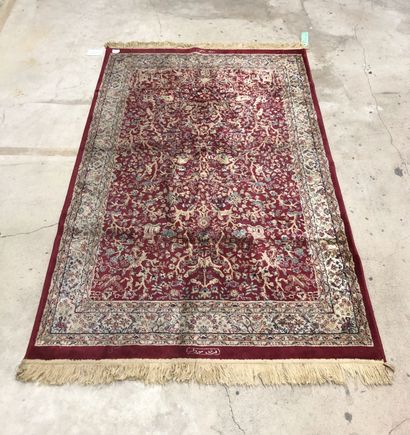 Wool and silk carpet decorated with a tree...