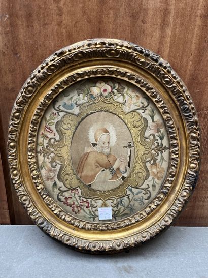 Oval embroidery depicting a praying pope...