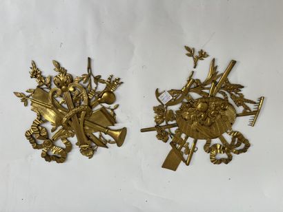 Two ornaments in gilt bronze depicting the...