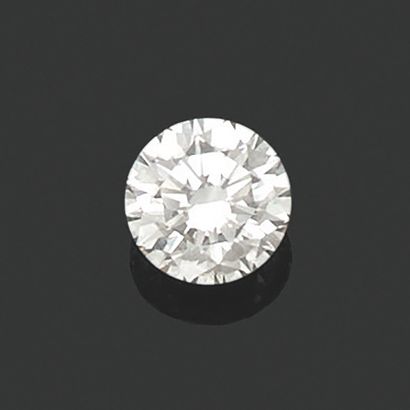 Round diamond 
on paper weighing 3.05 cts....