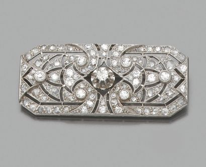 Plate brooch 
in platinum pierced with interlocking...
