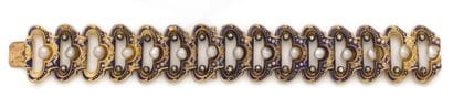 Bracelet 
en or 18K (750) articulé de maillons...