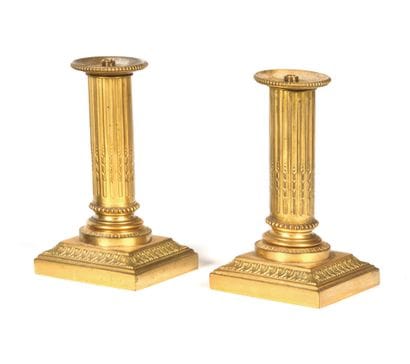 Two small candlesticks mounted as lamps,...
