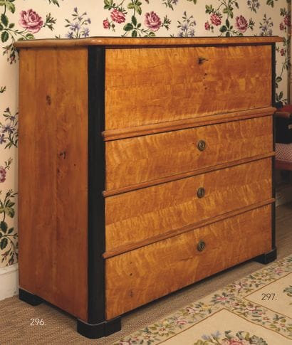 Small maple-veneered chest of drawers opening...