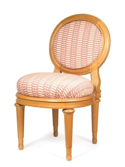 Set of eight natural wood chairs with medallion...