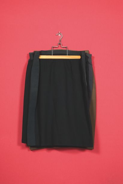 Four wool and crepe skirts, two black, one...