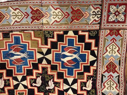 Petit point rug decorated with doves in medallions...