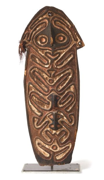 Gope board with sinuous decoration depicting...