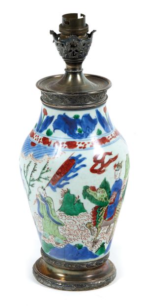 China
Vase in green family enamels depicting...