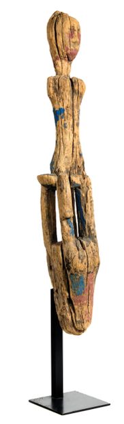 Figure seated 
on a stool resembling an animal's...