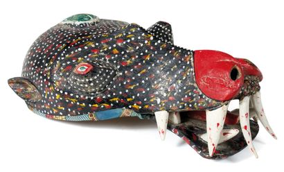 Mask 
depicting an animal with impressive...