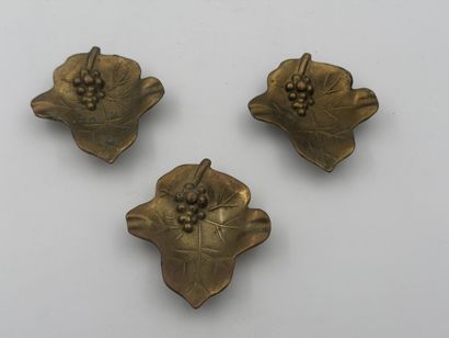 Set of three bronze dishes featuring a vine...