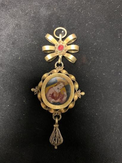 Deux pendentifs
en argent et argent doré....